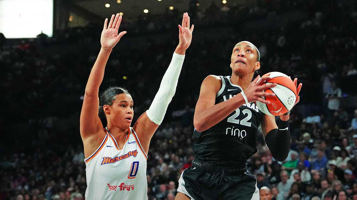 Las Vegas Aces center A'ja Wilson (22) looks to shoot against Phoenix Mercury forward Satou Sabally (0) during the fourth quarter of game one of the 2025 WNBA Finals at Michelob Ultra Arena.