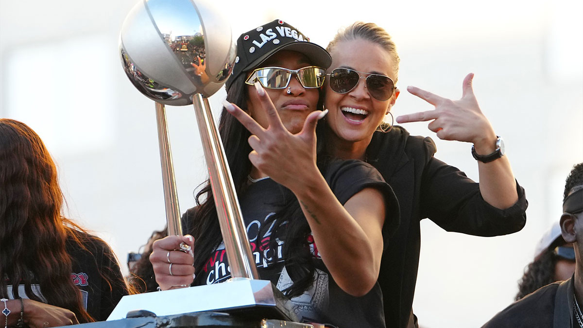 Las Vegas Aces center A'Ja Wilson (22) and head coach Becky Hammond pose for a photo during the 2025 WNBA Championship parade at Toshiba Plaza.