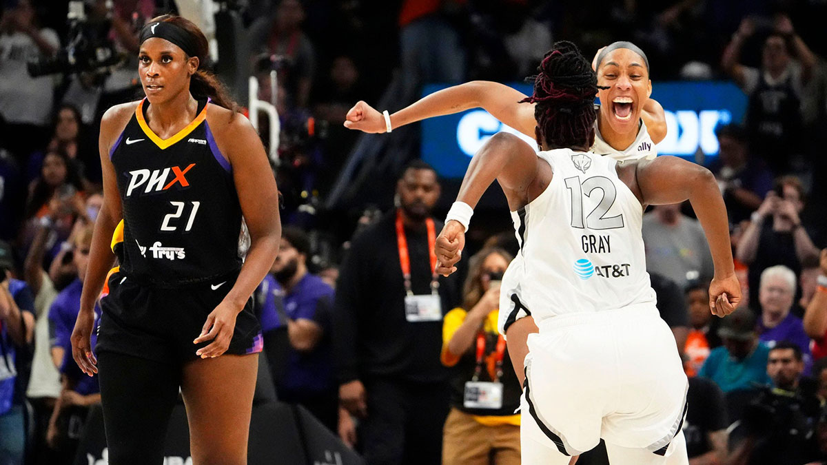Las Vegas Aces guard Chelsea Gray (12) and center A'ja Wilson (22) celebrate after defeating the Phoenix Mercury 97-86 to win the WNBA Championship in a four-game sweep at Mortgage Matchup Center on Oct. 10, 2025, in Phoenix.