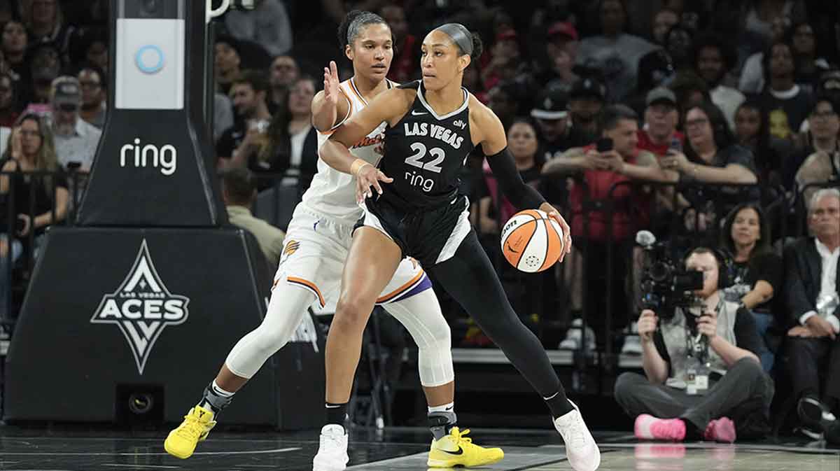 Las Vegas Aces center A'ja Wilson (22) dribbles against Phoenix Mercury forward Alyssa Thomas (25) in the first quarter of their game at Michelob Ultra Arena.