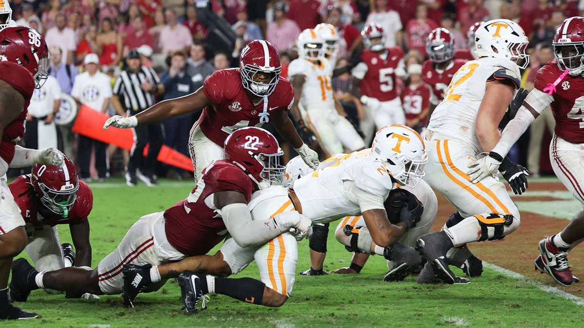 Tennessee Volunteers running back Peyton Lewis (2) reaches for the end zone while being defended by Alabama Crimson Tide defensive lineman LT Overton (22) in the fourth quarter at Saban Field at Bryant-Denny Stadium. Mandatory Credit: David Leong-Imagn Images