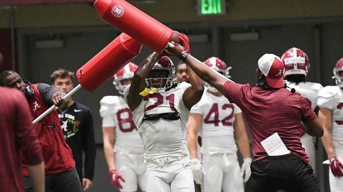 Alabama wide receiver Bubba Hampton (21) catches a pass during practice in the Hank Crisp Indoor Practice Facility.