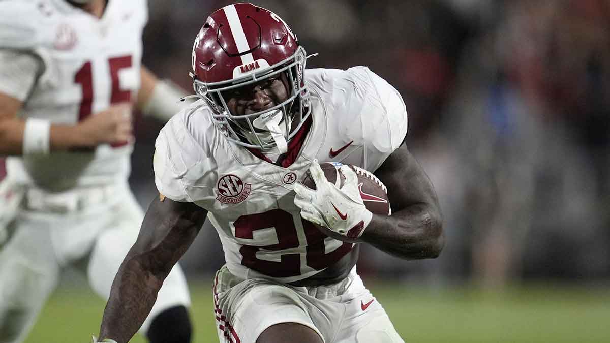 Alabama Crimson Tide running back Jam Miller (26) runs against the Georgia Bulldogs in the first half at Sanford Stadium.