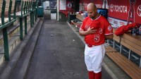 Los Angeles Angels first baseman Albert Pujols in the dugout during the national anthem before the start of a game against the Texas Rangers.
