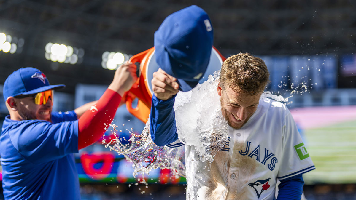 Toronto Blue Jays outfielder Myles Straw (3) has Gatorade dumped on him by catcher Alejandro Kirk (30) after defeating the Milwaukee Brewers at Rogers Centre.