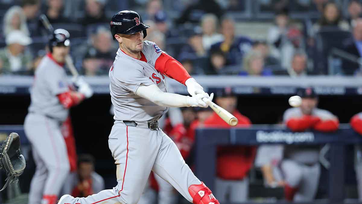 Boston Red Sox third baseman Alex Bregman (2) hits a single during the eighth inning against the New York Yankees during game two of the Wildcard round for the 2025 MLB playoffs at Yankee Stadium.