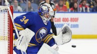 Buffalo Sabres goaltender Alex Lyon (34) looks to make a save during the first period against the Florida Panthers at KeyBank Center.