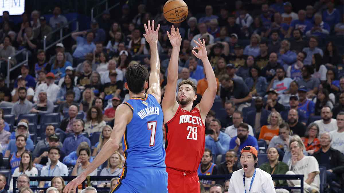 Houston Rockets center Alperen Sengun (28) shoots over Oklahoma City Thunder center Chet Holmgren (7) during the second half at Paycom Center.