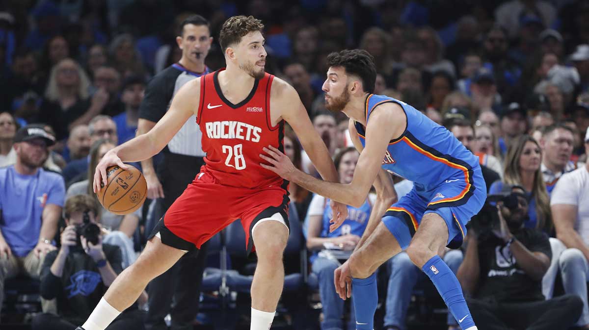 Houston Rockets center Alperen Sengun (28) drives to the basket against Oklahoma City Thunder center Chet Holmgren (7) during the first half at Paycom Center.
