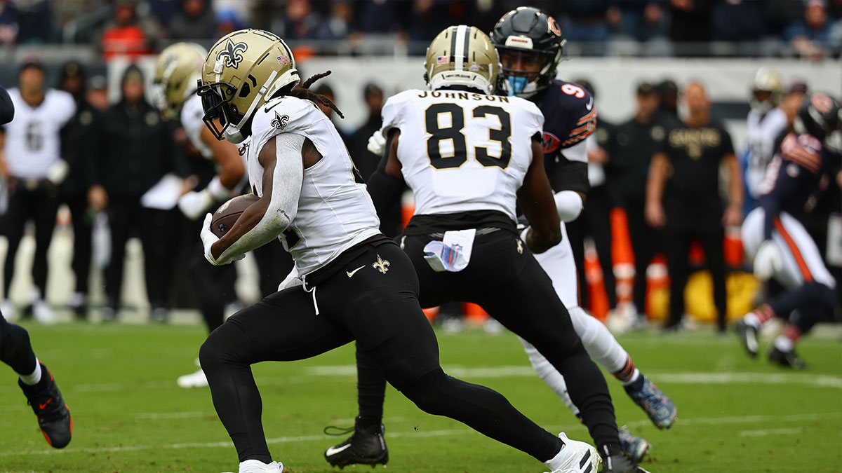 New Orleans Saints running back Alvin Kamara (41) rushes the ball against the Chicago Bears during the first quarter at Soldier Field. 