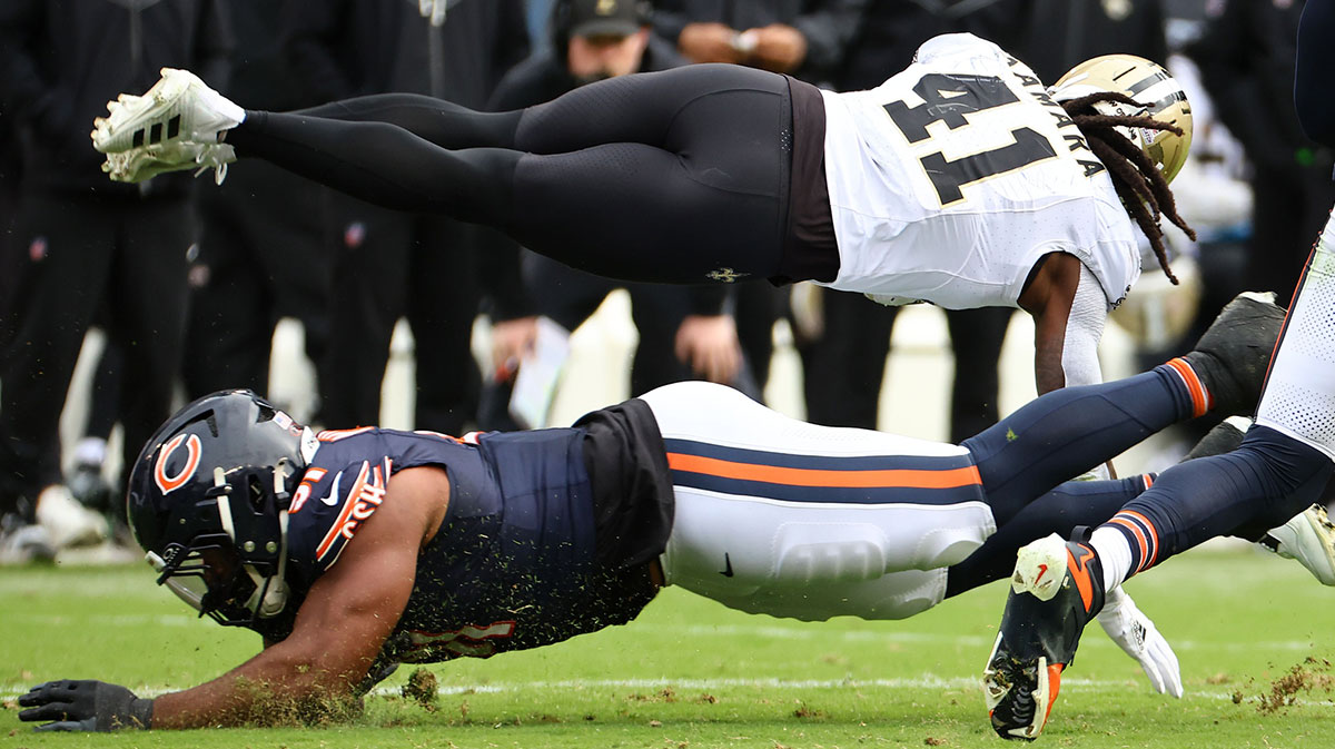 New Orleans Saints running back Alvin Kamara (41) dives for a first down against the Chicago Bears during the second half at Soldier Field.