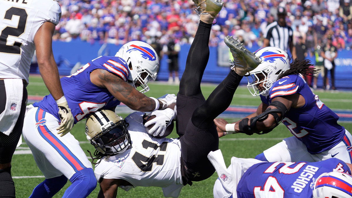 Buffalo Bills cornerback Christian Benford finishes the tackle after safety Cole Bishop sent New Orleans Saints running back Alvin Kamara in the air after a diving tackle during first half action of the Bills home game against the New Orleans Saints in Orchard Park on Sept. 28, 2025. Coming in on the right to help out is Buffalo Bills linebacker Dorian Williams.
