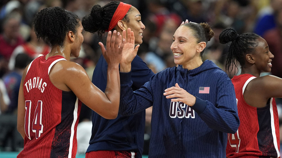 United States power forward Alyssa Thomas (14) and shooting guard Diana Taurasi (12) celebrate after defeating Germany in a women’s group C game during the Paris 2024 Olympic Summer Games at Stade Pierre-Mauroy.