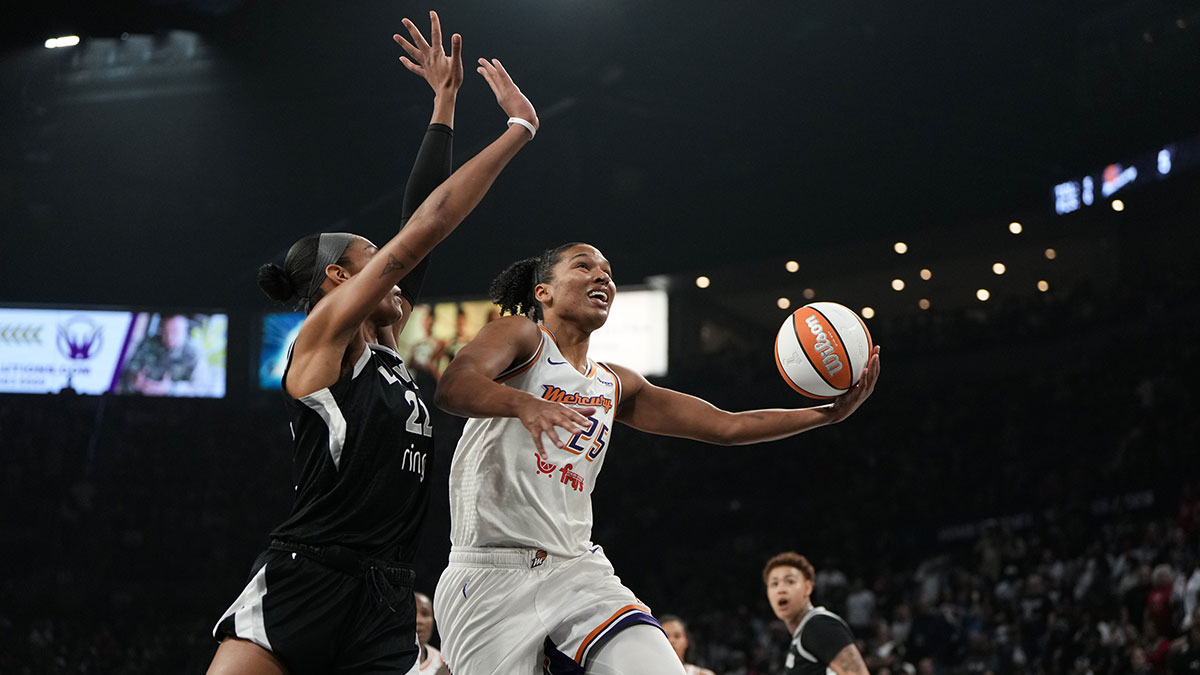 Phoenix Mercury forward Alyssa Thomas (25) shoots a layup against Las Vegas Aces center A'ja Wilson (22) during the first quarter of game two of the 2025 WNBA Finals at Michelob Ultra Arena.