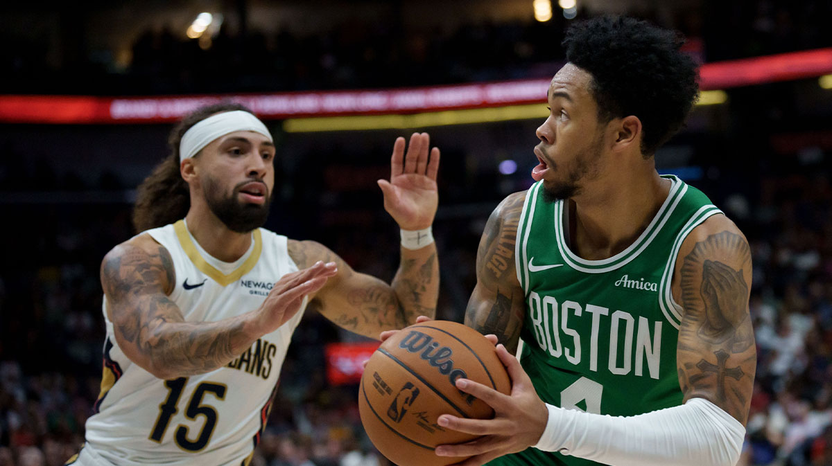 Boston Celtics guard Anfernee Simons (4) shoots against New Orleans Pelicans guard Jose Alvarado (15) during the first half at Smoothie King Center. Mandatory Credit: Matthew Hinton-Imagn Images