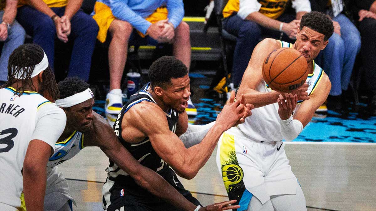 Indiana Pacers guard Tyrese Haliburton (0) steals the ball from Milwaukee Bucks forward Giannis Antetokounmpo (34) during game five of the first round for the 2024 NBA Playoffs at Gainbridge Fieldhouse