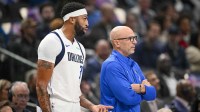 Dallas Mavericks forward Anthony Davis (3) exchanges words with Dallas Mavericks head coach Jason Kidd as Davis walks off the court during the first quarter at the American Airlines Center.