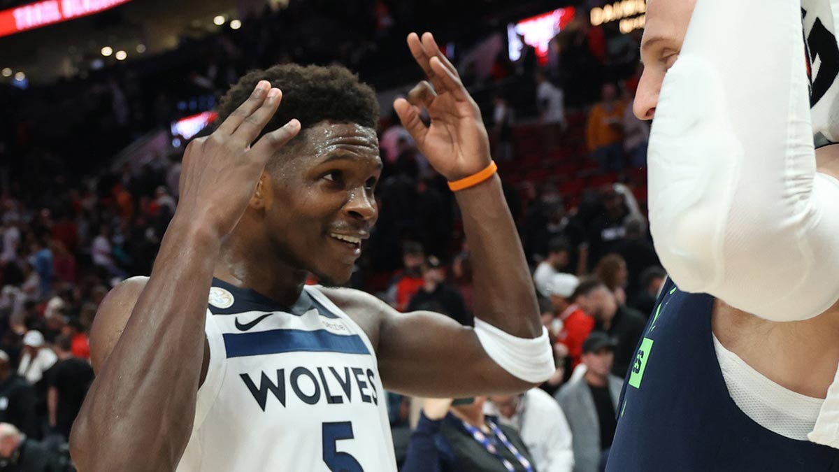 Minnesota Timberwolves guard Anthony Edwards (5) reacts after a 118-114 win over against the Portland Trail Blazers in the second half at Moda Center.