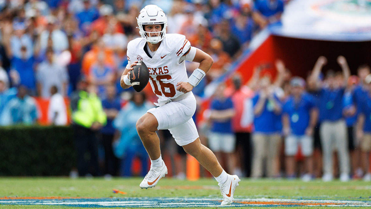 Texas Longhorns quarterback Arch Manning (16) runs with the ball against the Florida Gators during the first half at Ben Hill Griffin Stadium.