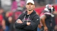 Arizona Cardinals head coach Jonathan Gannon stands on the field before their game against the Tennessee Titans at State Farm Stadium.