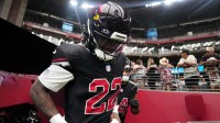 Arizona Cardinals running back Michael Carter (22) takes the field before they play against the Tennessee Titans at State Farm Stadium in Glendale on Oct. 5, 2025.