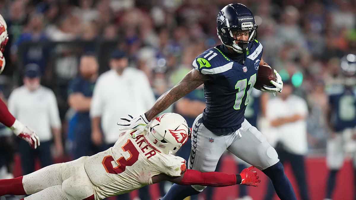 Arizona Cardinals safety Budda Baker (3) dives after Seattle Seahawks receiver Jaxon Smith-Njigba (11)