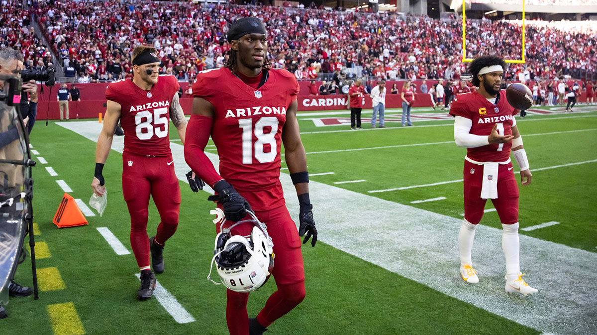 Arizona Cardinals wide receiver Marvin Harrison Jr. (18) and tight end Trey McBride (85) with quarterback Kyler Murray (1) against the San Francisco 49ers at State Farm Stadium.