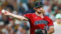 Arizona Diamondbacks starting pitcher Zac Gallen (23) throws to first base for an out during the second inning against the San Diego Padres at Petco Park.