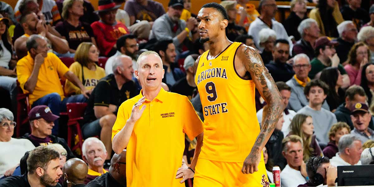 Arizona State Sun Devils head coach Bobby Hurley talks to center Shawn Phillips Jr (9) during the second half against the Texas Tech Red Raiders at Desert Financial Arena.