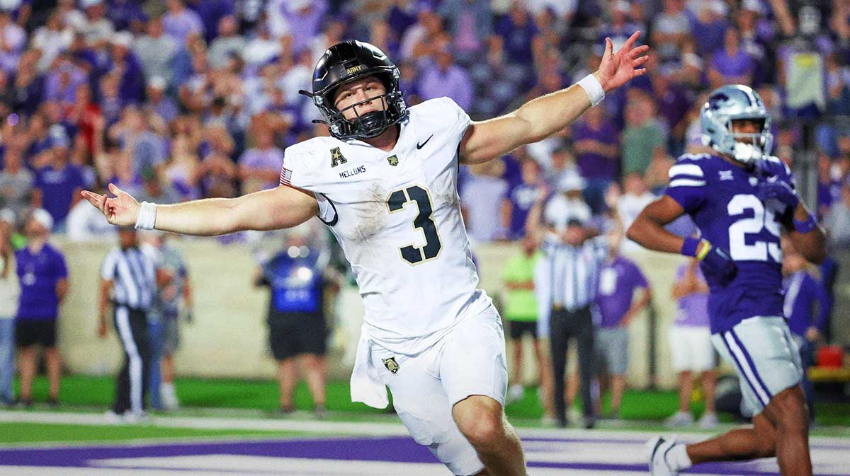 Army Black Knights football quarterback Cale Hellums (3) celebrates a game-winning touchdown in the fourth quarter against the Kansas State Wildcats at Bill Snyder Family Football Stadium.