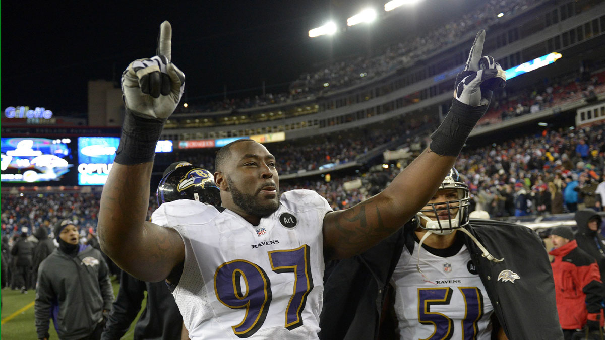 Baltimore Ravens defensive end Arthur Jones (97) celebrates with safety Brendan Ayanbadejo (51) in the fourth quarter against the New England Patriots in the AFC championship game at Gillette Stadium. The Ravens defeated the Patriots 28-13.