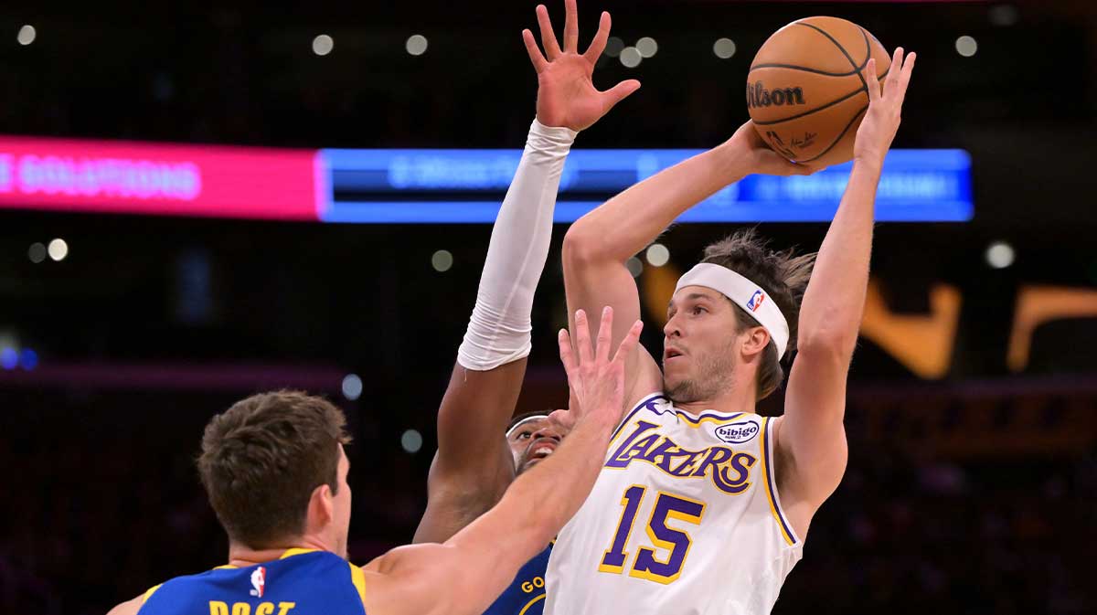 Los Angeles Lakers guard Austin Reaves (15) is defended by Golden State Warriors center Quinten Post (21) in the first half at Crypto.com Arena.