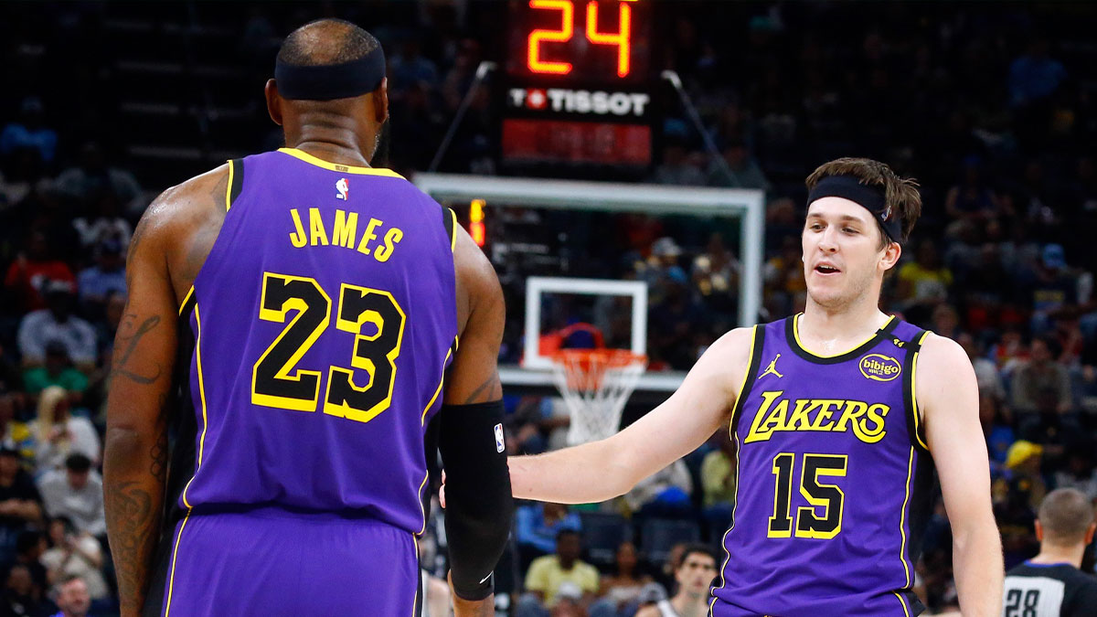 Los Angeles Lakers guard Austin Reaves (15) reacts with forward LeBron James (23) during the second quarter against the Memphis Grizzlies at FedExForum.