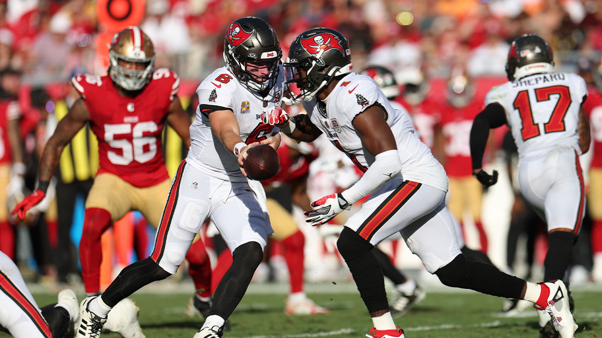 Tampa Bay Buccaneers quarterback Baker Mayfield (6) hands the ball off to running back Rachaad White (1) during the second quarter against the San Francisco 49ers at Raymond James Stadium.