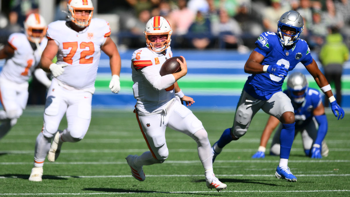 Tampa Bay Buccaneers quarterback Baker Mayfield (6) scrambles against the Seattle Seahawks during the first half at Lumen Field.
