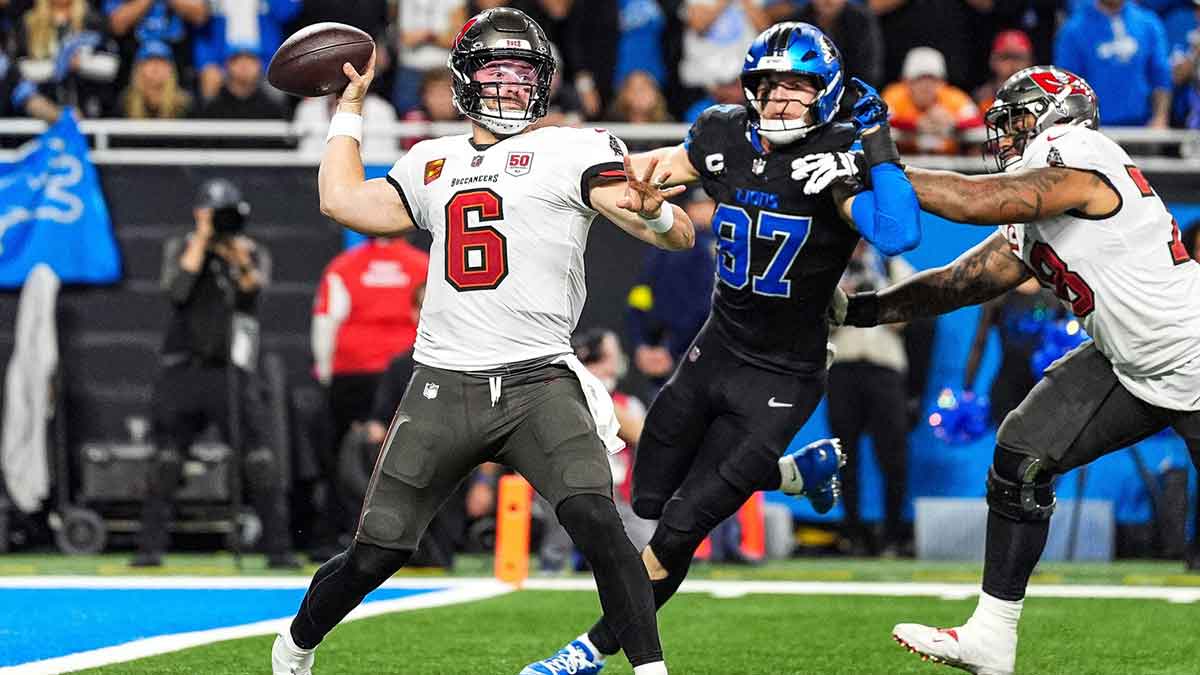 Tampa Bay Buccaneers quarterback Baker Mayfield (6) makes a pass against Detroit Lions defensive end Aidan Hutchinson (97) during the second half at Ford Field in Detroit on Monday, Oct. 20, 2025.