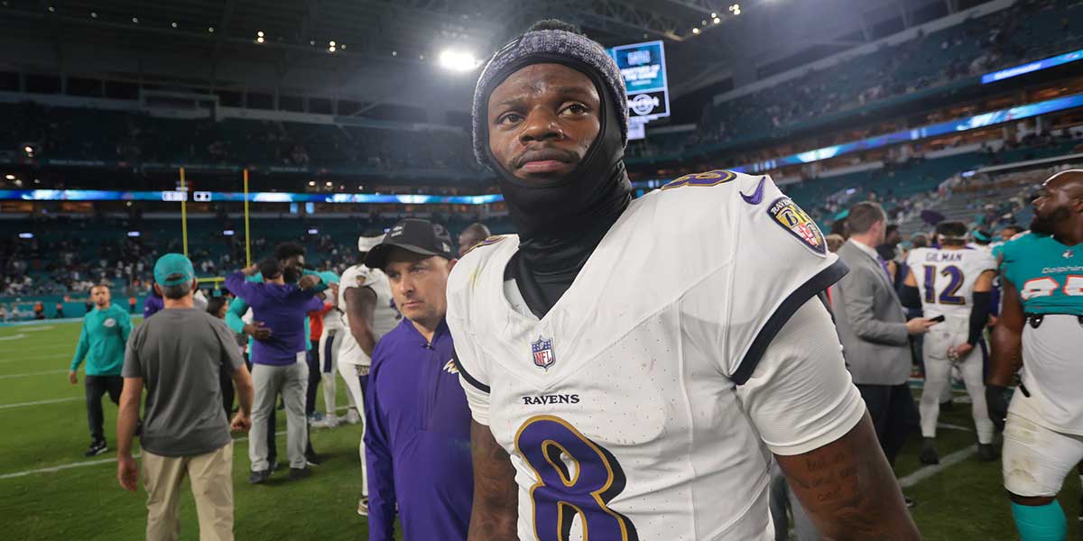 Baltimore Ravens quarterback Lamar Jackson (8) walks off the field after a win over Miami Dolphins at Hard Rock Stadium.