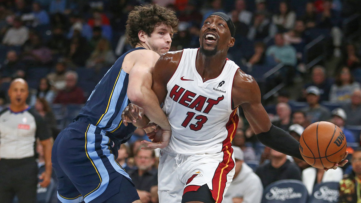 Miami Heat center Bam Adebayo (13) drives to the basket as Memphis Grizzlies center PJ Hall (16) defends during the first quarter at FedExForum.