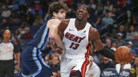 Miami Heat center Bam Adebayo (13) drives to the basket as Memphis Grizzlies center PJ Hall (16) defends during the first quarter at FedExForum.