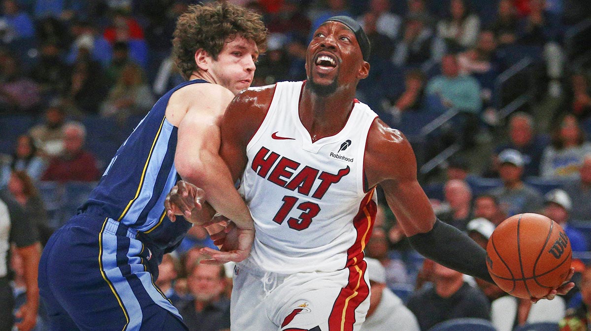 Miami Heat center Bam Adebayo (13) drives to the basket as Memphis Grizzlies center PJ Hall (16) defends during the first quarter at FedExForum.