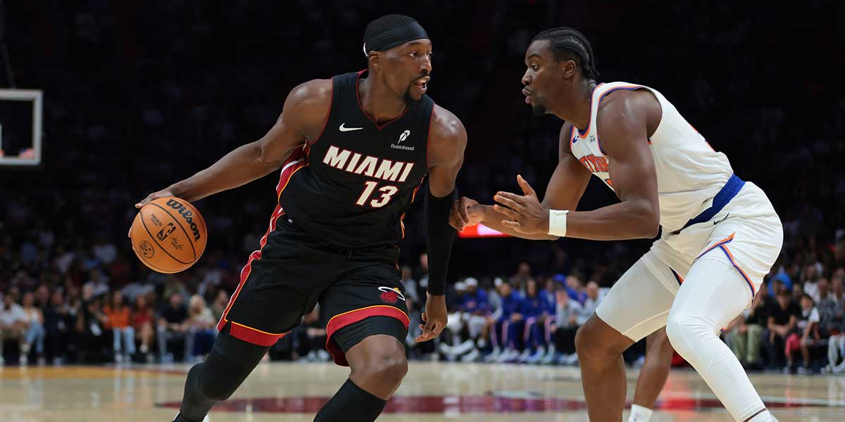 Miami Heat center Bam Adebayo (13) drives to the basket against New York Knicks center Ariel Hukporti (55) during the first quarter at Kaseya Center.