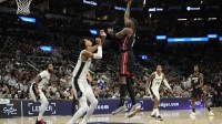 Miami Heat forward Bam Adebayo (13) shoots over San Antonio Spurs forward Victor Wembanyama (1) during the second half at Frost Bank Center.