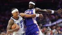 Orlando Magic forward Paolo Banchero (5) drives against Philadelphia 76ers center Adem Bona (30) during the first quarter at Xfinity Mobile Arena