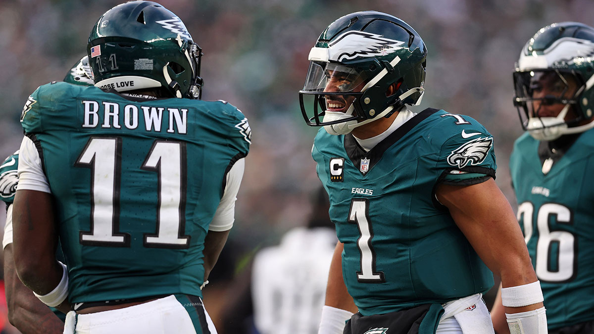 Philadelphia Eagles quarterback Jalen Hurts (1) and wide receiver A.J. Brown (11) celebrate after a touchdown against the Washington Commanders during the first half in the NFC Championship game at Lincoln Financial Field.