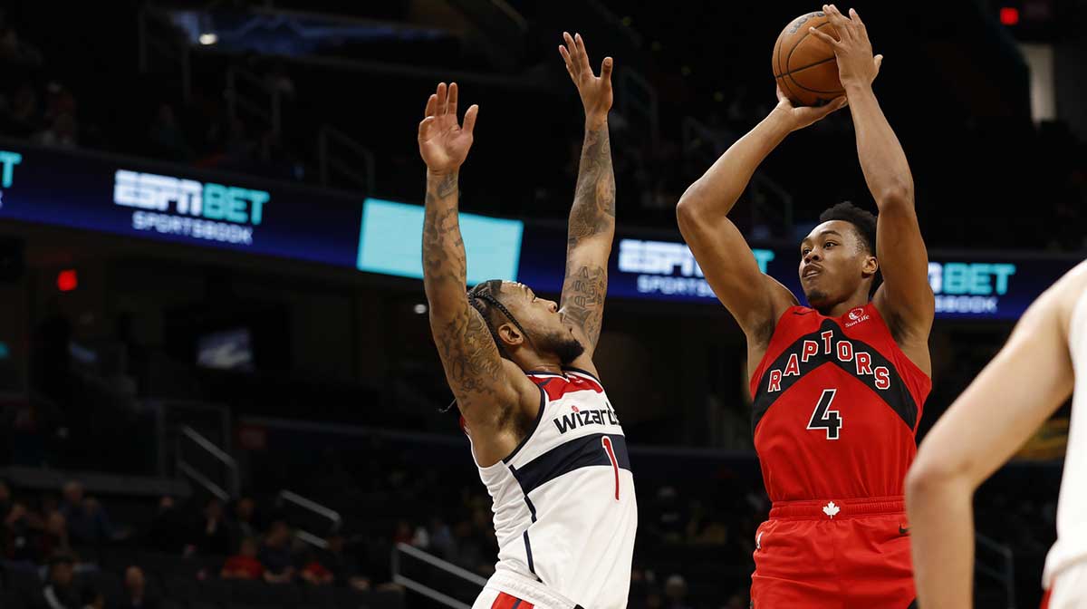 Toronto Raptors forward/guard Scottie Barnes (4) shoots the ball as Washington Wizards forward Cam Whitmore (1) defends in the first half at Capital One Arena.