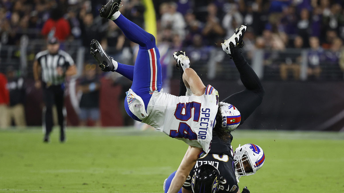 Sep 29, 2024; Baltimore, Maryland, USA; Baltimore Ravens tight end Isaiah Likely (80) is tackled after catching a pass by Buffalo Bills cornerback Christian Benford (47) and Bills linebacker Baylon Spector (54) at M&T Bank Stadium. Mandatory Credit: Geoff Burke-Imagn Images