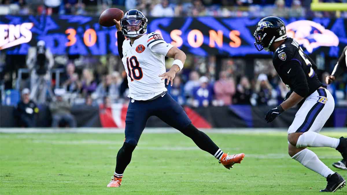 Chicago Bears quarterback Caleb Williams (18) throws a pass as Baltimore Ravens linebacker Kyle Van Noy (53) defends during the fourth quarter at M&T Bank Stadium