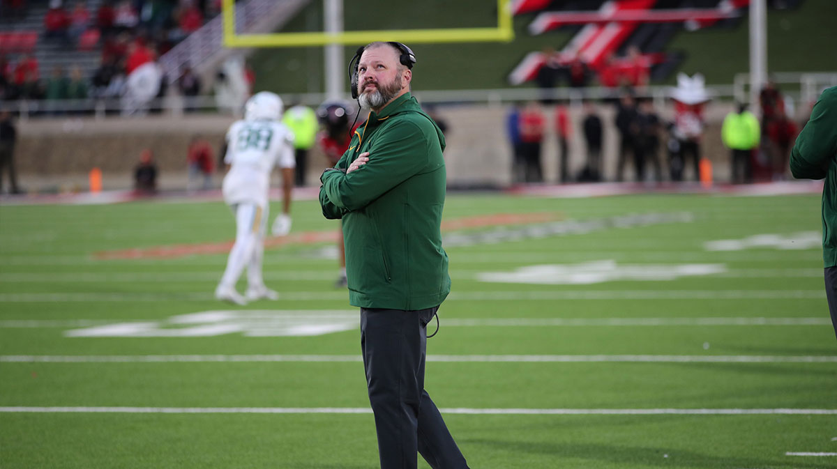 Baylor Bears assistant coach Mason Miller watches the big screen in the second half during the game against the Texas Tech Red Raiders at Jones AT&T Stadium and Cody Campbell Field.