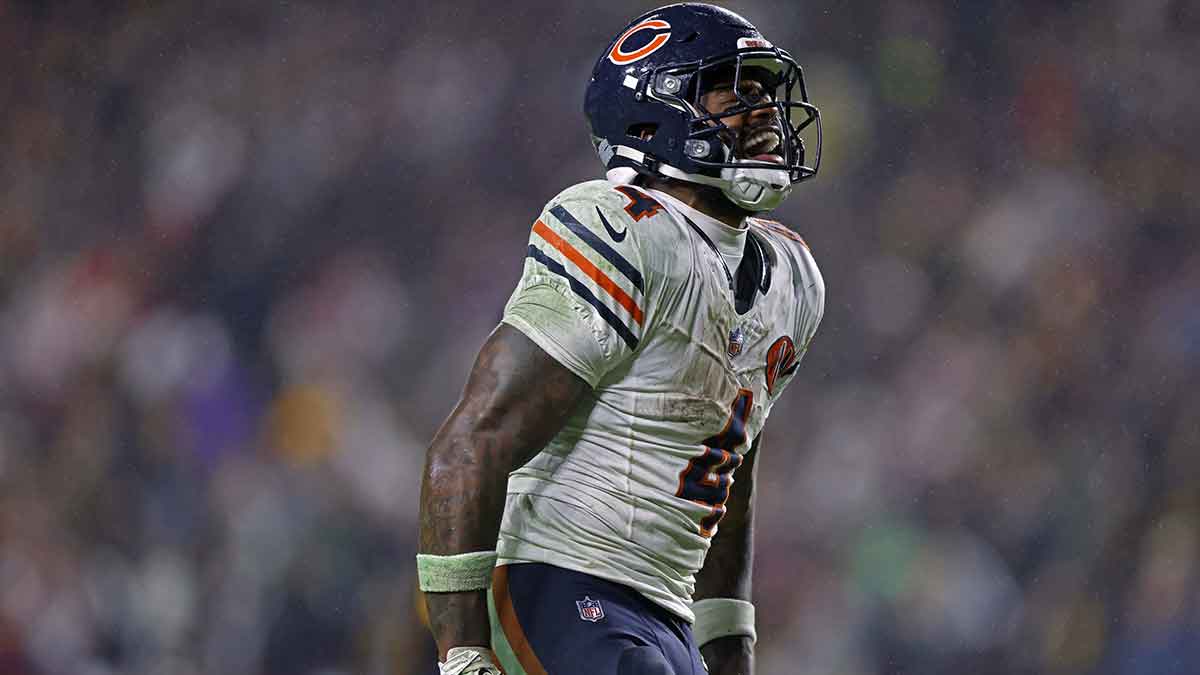 Chicago Bears running back D'Andre Swift (4) reacts to a first down during the fourth quarter against the Washington Commanders at Northwest Stadium.