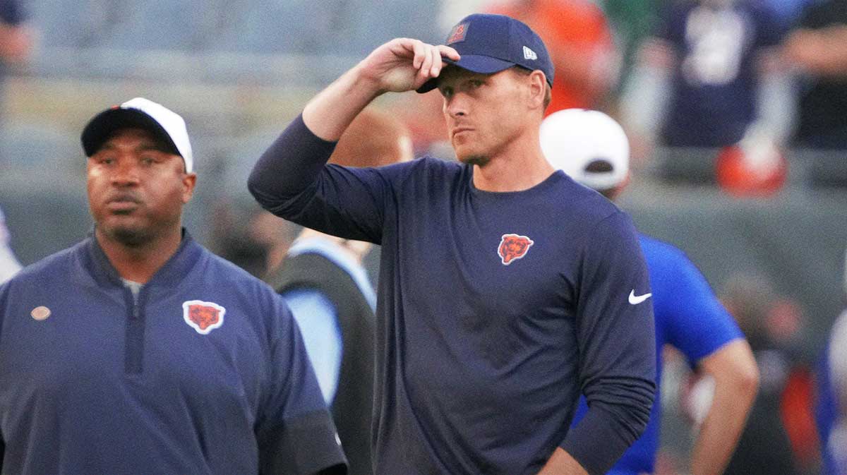 Chicago Bears head coach Ben Johnson on the field before a game against the Buffalo Bills at Soldier Field.